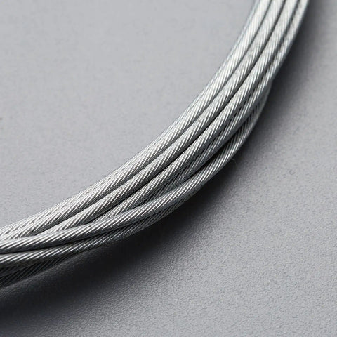 Close-up of Universal Bicycle Shifter Cable Housing Set For Derailleur Systems Durable Black Upgrade Kit to restore smooth gear shifts.