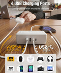 3 Ft Short Extension Cord Surge Protector Power Strip 8 In 1 with 4 USB ports charging multiple devices on wooden desk.