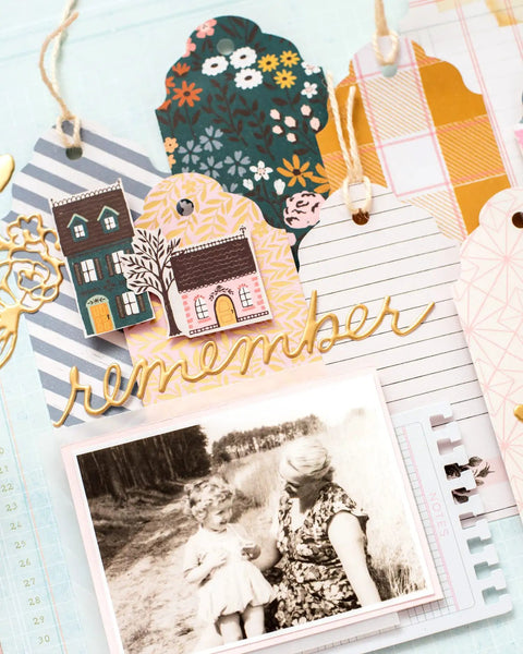 Scrapbook page with gift tags made using 3-In-1 Round Tag Punch For Crafting And Scrapbooking, multi-color tool.