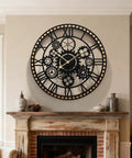Large Farmhouse Wall Clock for Living Room Decor visible gear dial, black iron design with wooden accents above a rustic mantel.