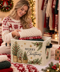 Foldable Christmas tree storage bin measuring 10.6 x 10.6 x 14.2 inches, holding neatly folded sweaters, labeled 'Merry Christmas'.