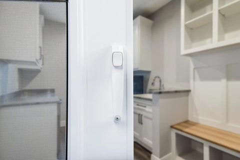 Close-up of white push-button latch on Corrosion Resistant Screen Door Hardware Kit With Pneumatic Closer And Push Button Latch For Out Swinging Doors No Lockout Feature Includes Hold Open Washer And Jamb Bracket White.