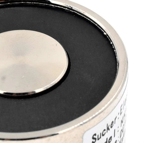 Close-up of Beefy 12V 250N Suction Magnet Electromagnet Round 40x20mm Lifting Solenoid for pick and place assembly.
