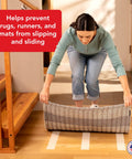 Person installing Double Sided Non Slip Carpet Tape For Area Rugs And Runners That Delivers A Residue Free Long Lasting Bond And Easy Reuse