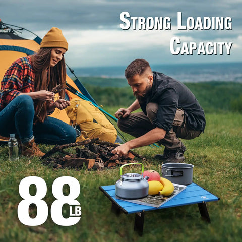 Ultralight Folding Beach Table For Camping And Picnics Portable Aluminum Side Table with food, camping gear, and campers in background