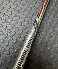 Dynamic Gold Tour Issue VSS Spinner 115 Wedge Flex Shaft.355 inch black golf shaft close-up on textured surface