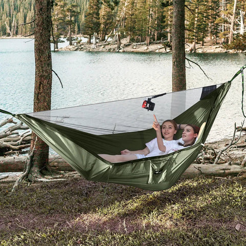 Camping Hammock With Mosquito Net And Ridge Rope For Two, Extra Large 114x55 Inch, outdoors by lake, two people inside