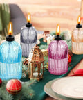Glass Tabletop Torch Set Four Pack For Outdoor Use With 13.5 Oz Citronella Fuel displayed on festive table