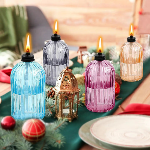 Glass Tabletop Torch Set Four Pack For Outdoor Use With 13.5 Oz Citronella Fuel displayed on festive table