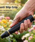Person holding high pressure car wash water gun with booster nozzle, showing anti-slip grip and length in garden.