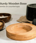 Heavy Duty Granite Mortar And Pestle Set 2 Cup Stone Grinder For Spices And Herbs With Non Slip Wooden Base close-up on base