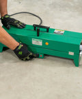 Greenlee Electric Pvc Pipe Heater For 1/2 To 2 Inch Conduit, showing operator using switch on heating unit.