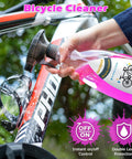 Bike Chain Cleaner Kit With Bicycle Cleaner Degreaser Lubricant And 12 Piece Cleaning Set spraying cleaner on bike frame