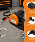 Grease Monkey Approved 12 Volt Electric Oil Extractor Pump With 60 Watt Motor and Reinforced Hose Clamps, black and orange design, allows easy fluid transfer.