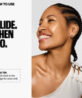 Cooling Under Eye Gel Stick Slays Puffiness With Caffeine And Seawater For An Instant Wake Up Vibe Hydrates Tired Skin With Clean Vegan Essentials Perfect Travel Friendly Pick Me Up Skincare Game Changer shown on a smiling woman with braids.