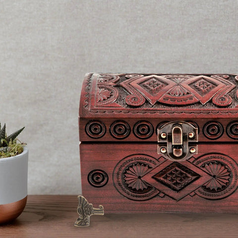 Eight-Piece Zinc Alloy Antique Box Feet For Jewelry Boxes And Vintage Furniture shown with a carved wooden jewelry box.