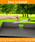 Magnetic Design 10 Inch Griddle Spatula Holder Stainless Steel Tool Rack For Flat Top Griddles And Grills Grab And Go Barbecue Organizer Durable Kitchen Accessories 2 Pack being installed on a flat griddle.