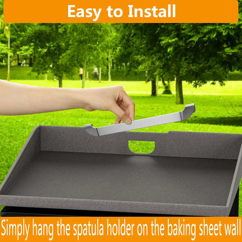 Magnetic Design 10 Inch Griddle Spatula Holder Stainless Steel Tool Rack For Flat Top Griddles And Grills Grab And Go Barbecue Organizer Durable Kitchen Accessories 2 Pack being installed on a flat griddle.