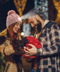 Couple exchanging gift, woman wearing Unisex Winter Beanie With Built In LED Light Headlamp Hat USB Rechargeable For Men And Women.