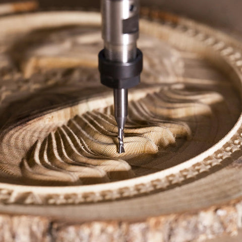 SpeTool 5pc down-cut spiral router bit set; carbide bits, 1/4 in shank, 1/8 in diameter, cutting wood, close-up