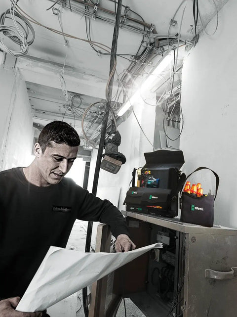 Electrician using 2Go 4 Tool Quiver Compact Tool Belt Organizer for quick access in a construction site with heavy-duty durability.