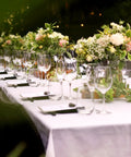 Outdoor dining with flowers on a Beefy Six Foot Folding Table With Handle Portable 330Lb Capacity HDPE Top Waterproof.