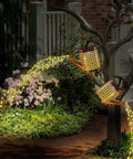 Two Pack Solar Watering Can Garden Lights hanging on tree, emitting cascading night lights for lawn path patio, outdoor decor