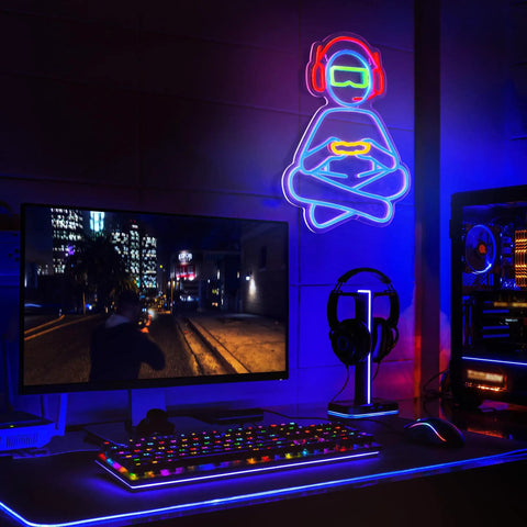 Gamer Neon Sign For Wall Decor 3D Dimmable USB Powered With 8 Modes Control transparent light up sign in a gaming setup.
