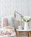Bedroom wall with Dew Drops XL Wall Stencil 24 X 39.5 In For Large Geometric Wall Patterns visible behind a bedroom setup.
