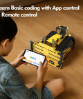 Child using a tablet to control a yellow excavator from the 5 In 1 STEM Building Kit With Remote Control Excavator 555-Piece Engineering Toy For Kids Ages 6 To 14 DIY Robotics And Science Gift For Boys And Girls.