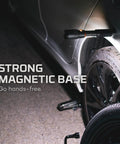 SLYDE KING 2K Rechargeable LED Flashlight With 4X Zoom Spotlight Or Floodlight attached to car wheel with magnetic base
