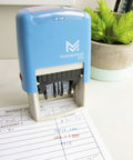 No Mess Self Inking Custom Stamp Kit With Dual Shade Blue And Red Ink Pads and Handy Tweezers on an invoice document.