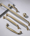 10 Pack Cabinet Knobs In Champagne Bronze Heavy Duty Zinc Alloy Hardware Handles For Kitchen Cabinets Bedrooms Dressers And Wardrobes Easy Install Durable Finish Classic Look For Any Home, shown with varying handle sizes on gray surface.