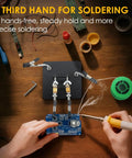Hands using soldering iron with Soldering Station Holder With Storage Box And Third Hand Tool on 4x4 inch metal non-slip base