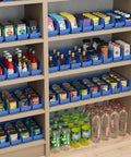 Heavy Duty Plastic Shelf Bins For Garage, Closet And Drawer Organization, 12 By 4 By 4 Inches, Blue, 24 Pack, Tough As Nails Storage Caddies For Shelves And Cabinets filled with various items on wooden shelves.