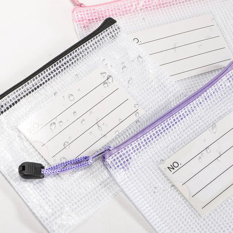 Close-up of 30 Pack Small Zipper Mesh Pouches With Label Pockets, A6 Size 6.3 By 4.7 Inches, Waterproof Mesh Zip Bags with labels.