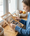 Woman using Weaving Comb Set for Newbies Three Piece Wood Knitting Loom Tool Kit With Large Eye Needle and Crochet Hook by window