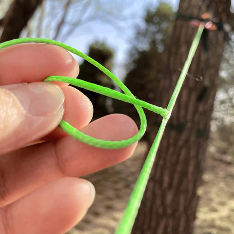 Close-up of 100 Ft UHMWPE Braided Cord 2mm Spliceable Utility Line for Camping Tarps in use outdoors