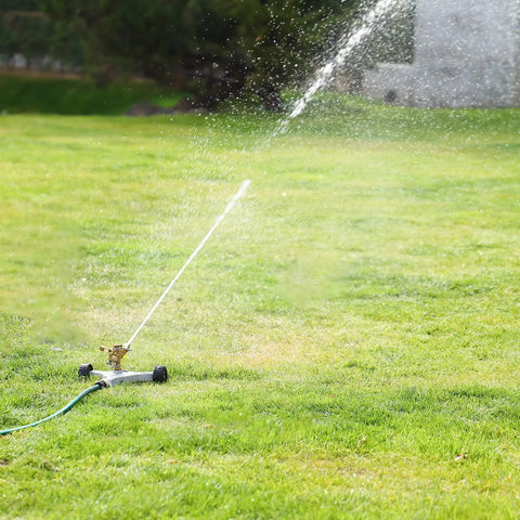 Heavy Duty Full Metal Pulsating Sprinkler With Wheeled Base on green lawn, 360 Degree Rotating Impact Sprinkler for wide lawn irrigation