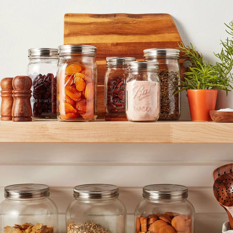 Wide-mouth jars on shelf with Stainless Steel One Piece Mason Jar Lids Wide Mouth 6 Pack Airtight Seal Rust Resistant Stackable