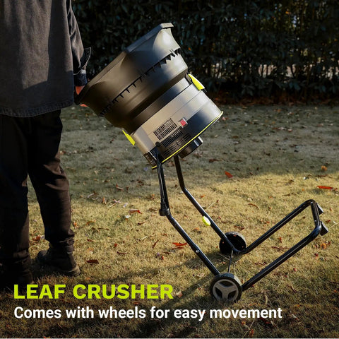 Man using Electric Leaf Mulcher Shredder With 15 Amp Motor Spinning 8200 RPM For 17 To 1 Reduction, on grassy yard