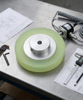 Beefy Rotary Encoder Meter Wheel With 6mm Aperture For Marking Machines And Inkjet Printers on a workbench with tools and drawings