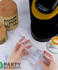 Hands holding filter holder from Water Filter Starter Kit For Keurig 2.0 Coffee Brewers near coffee machine.