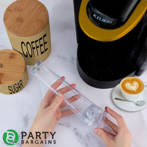 Hands holding filter holder from Water Filter Starter Kit For Keurig 2.0 Coffee Brewers near coffee machine.