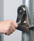 Hand turning Heavy Duty Stainless Steel Flagpole Pulley And Crank Handle Kit on metal pole, outdoor flag hardware