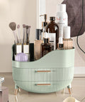 Slick Green Makeup Organizer With Two Deep Drawers And Sturdy Carry Handle, Large Skincare Storage Box For Vanity Tops, Holds Your Whole Daily Glam Stash On Any Dresser Or Bathroom Counter, filled with beauty products.