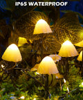 Sun Powered Mushroom String Lights, 20 LED over 32.8 feet, glowing in rain on garden pathway with IP65 waterproof rating