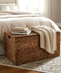 Large Water Hyacinth Wicker Storage Chest With Metal Frame in bedroom, 36 x 20 x 18.5 inches, brown, with books and blanket on top
