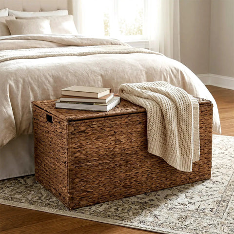 Large Water Hyacinth Wicker Storage Chest With Metal Frame in bedroom, 36 x 20 x 18.5 inches, brown, with books and blanket on top