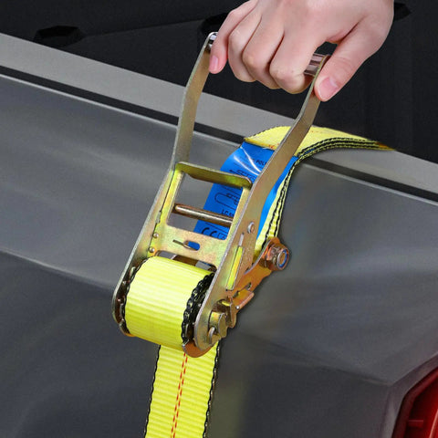 Heavy Duty Badass Ratchet Straps 4 Pack 2 Inch Wide By 27 Feet Long With Double J Hooks tightening cargo in a truck bed.